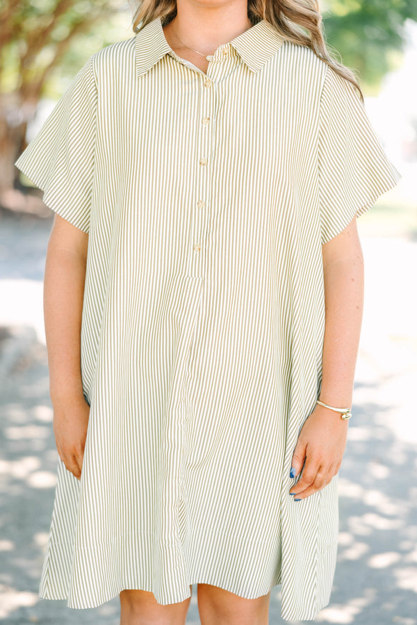 Plus size woman in a green stripe Sweet Breeze shirt dress with a flowy fit and button-down front.
