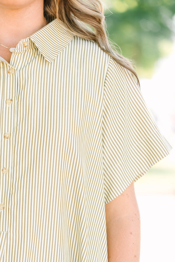 Plus size woman in a green stripe Sweet Breeze shirt dress with a flowy fit and button-down front.