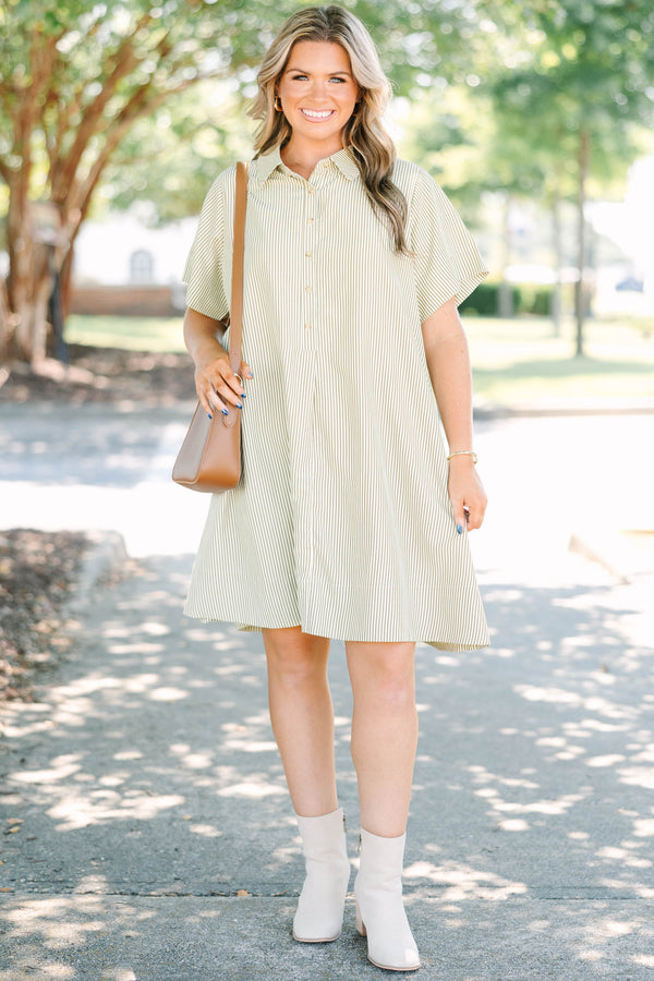 Plus size woman in a green stripe Sweet Breeze shirt dress with a flowy fit and button-down front.