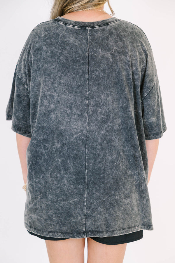 Plus Size black acid wash relaxed tee with a large white and yellow daisy graphic on the front.