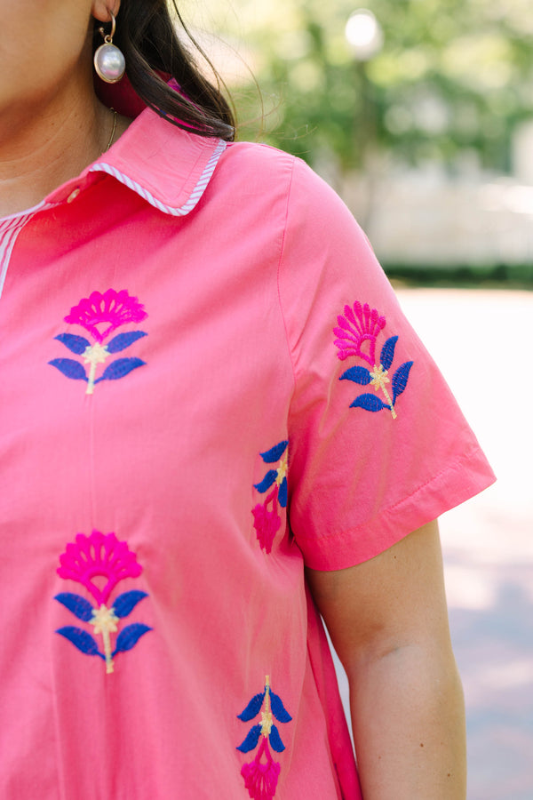 Plus Size pink button-down shirt dress with blue and magenta floral embroidery and short sleeves.