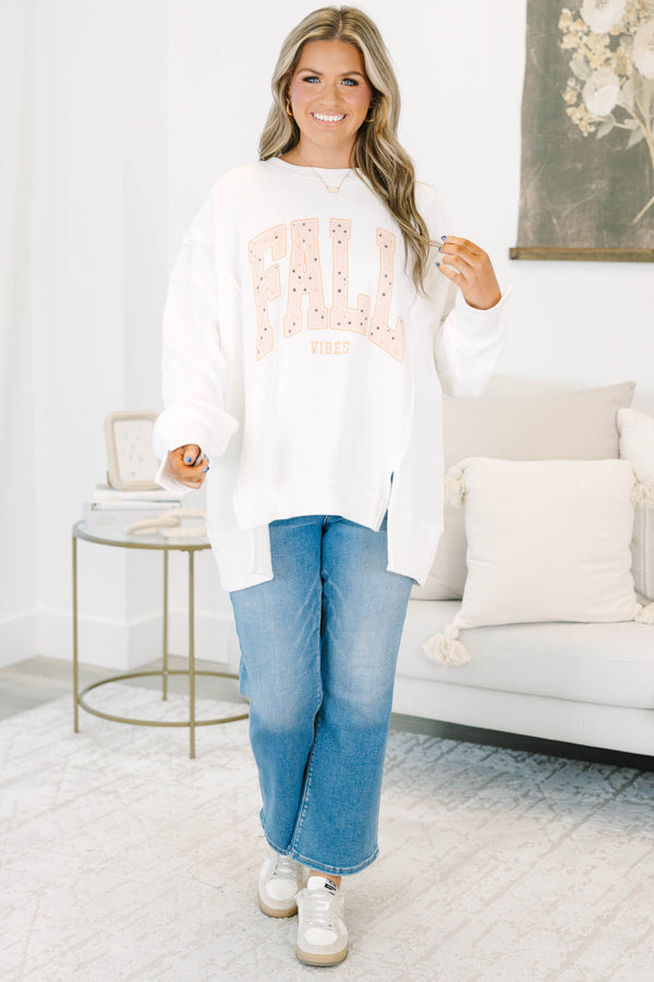 Plus Size ivory oversized crewneck sweatshirt with peach 'FALL VIBES' graphic and star details.