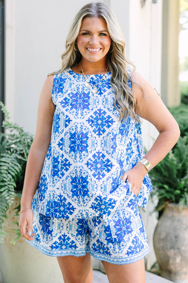 Plus size woman in a flowy blue tile print sleeveless top and matching shorts in 100% cotton.