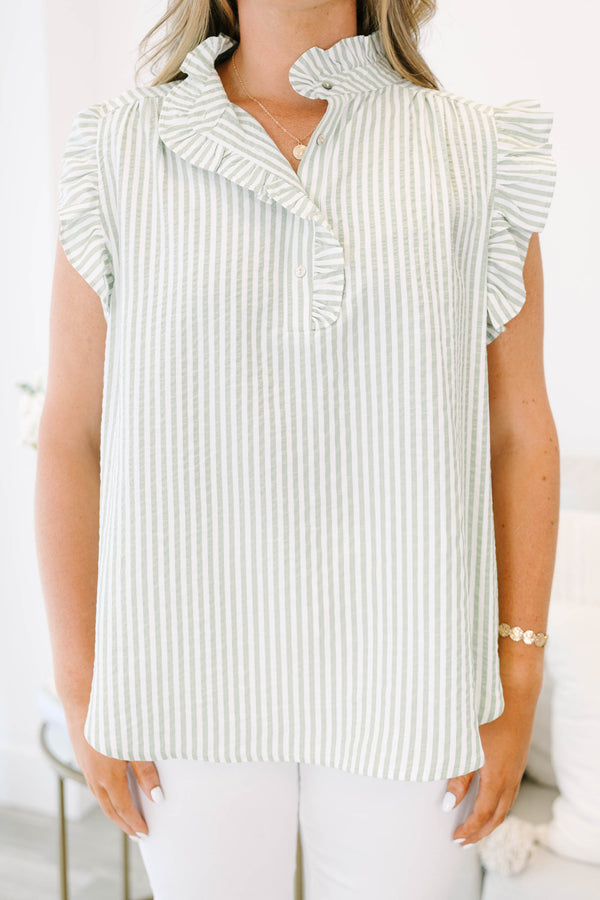 Plus Size green and white striped top with flutter sleeves, a ruffled collar, and button details.