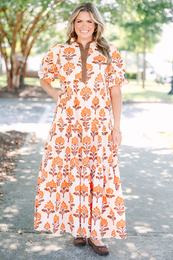 Plus Size orange floral tiered maxi dress with puff sleeves and a brown button-down neckline.