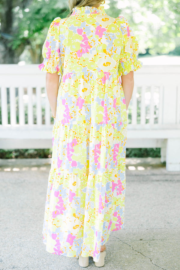 Plus Size yellow floral maxi dress with short puff sleeves, a tiered skirt, and a smocked collar.