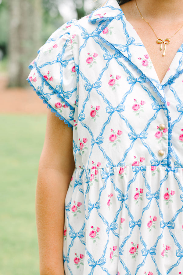 Plus Size white maxi dress with blue bow lattice and pink floral print, featuring a collared neck.