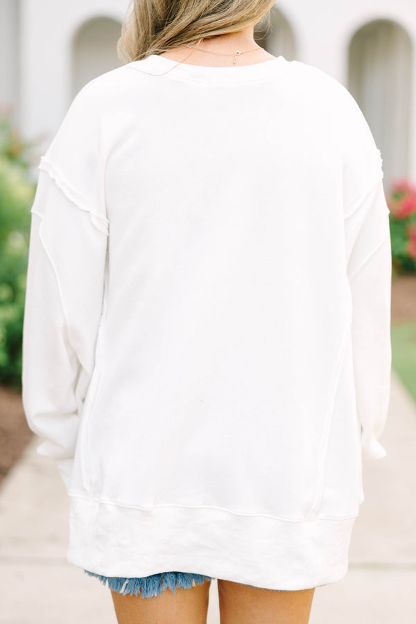 Plus Size ivory crew neck sweatshirt with a patriotic floral flag graphic and denim shorts.