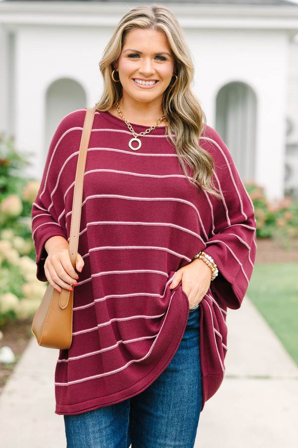 Plus Size burgundy and white horizontal striped knit sweater tunic with a relaxed fit.