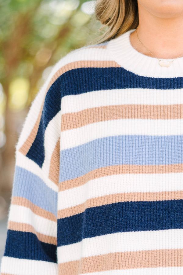 Plus Size oversized crewneck sweater with horizontal stripes in navy, light blue, tan, and white.