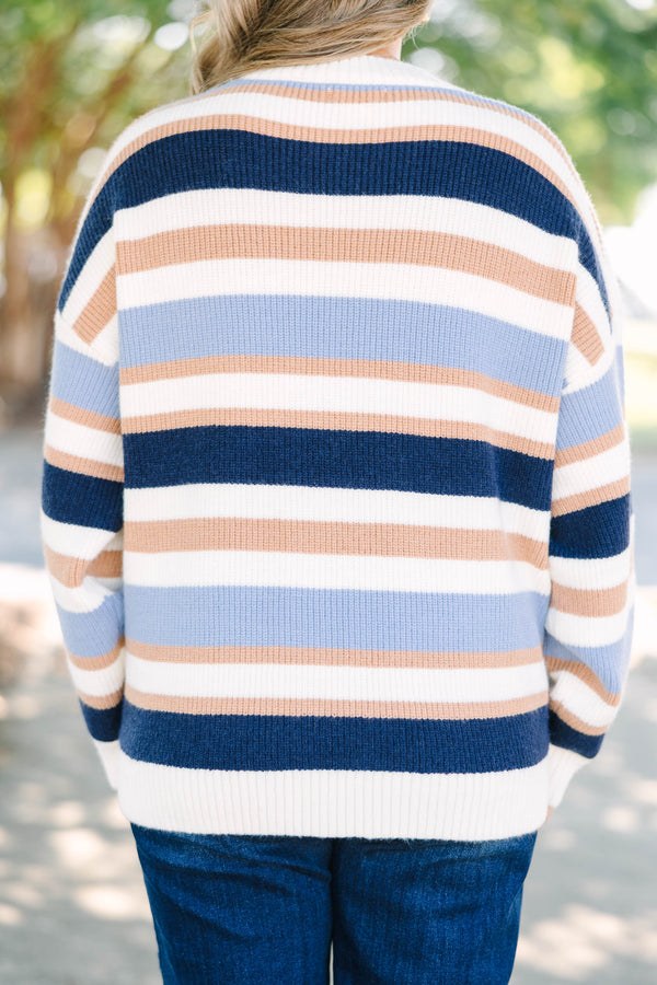 Plus Size oversized crewneck sweater with horizontal stripes in navy, light blue, tan, and white.