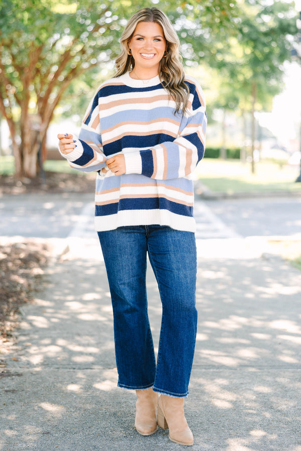 Plus Size oversized crewneck sweater with horizontal stripes in navy, light blue, tan, and white.