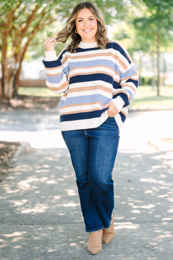 Plus Size oversized crewneck sweater with horizontal stripes in navy, light blue, tan, and white.