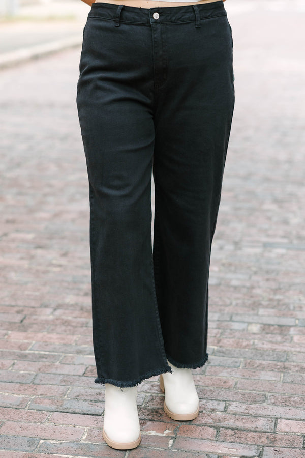 Plus Size black acid-washed wide-leg jeans with a frayed cutoff hem and a straight fit.