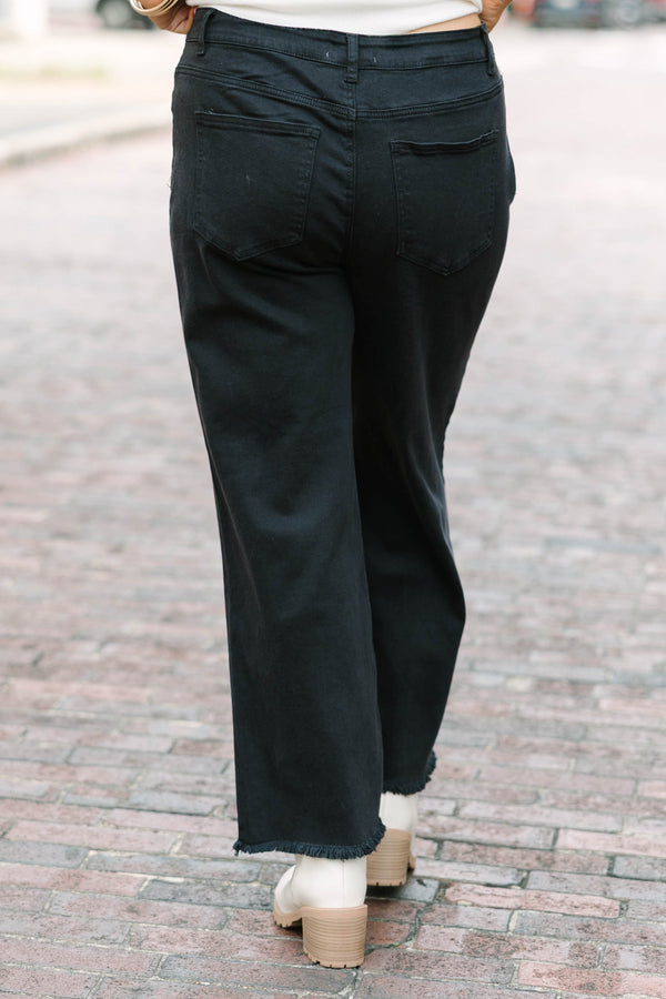 Plus Size black acid-washed wide-leg jeans with a frayed cutoff hem and a straight fit.
