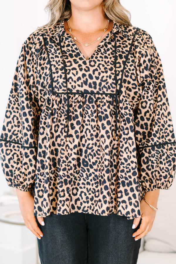 Plus Size leopard print babydoll top with long puff sleeves, a V-neckline, and black trim details.