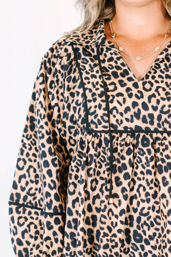 Plus Size leopard print babydoll top with long puff sleeves, a V-neckline, and black trim details.