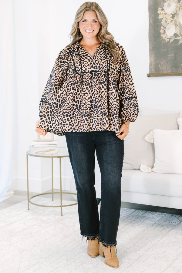 Plus Size leopard print babydoll top with long puff sleeves, a V-neckline, and black trim details.