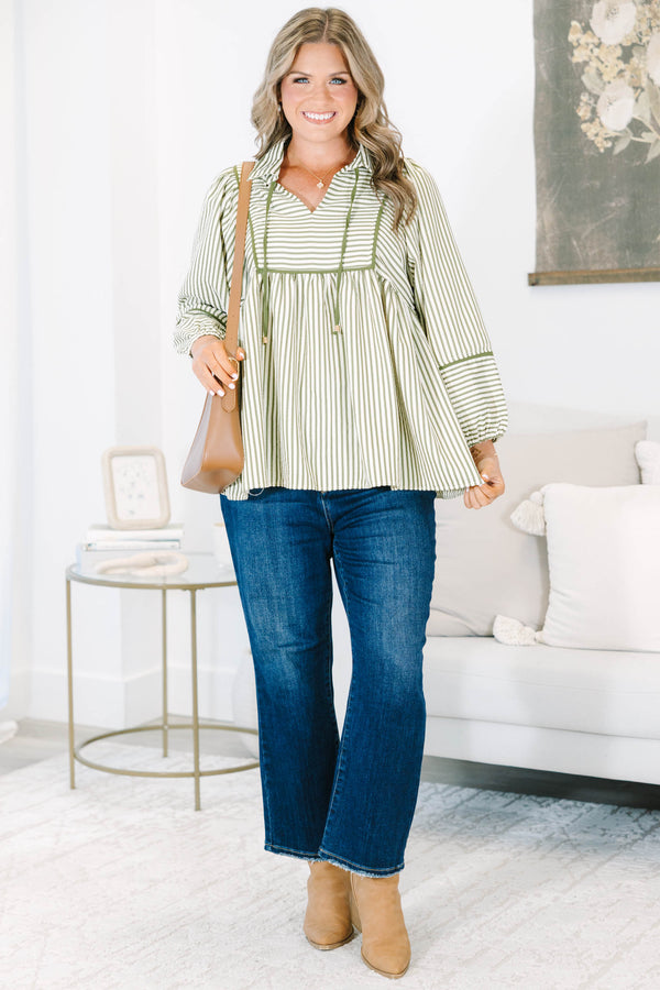 Plus size olive and white striped flowy top with long puff sleeves and a v-neckline.