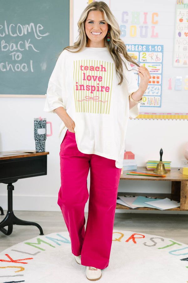 Plus Size ivory boyfriend tee with 'teach love inspire' graphic and pink pants.