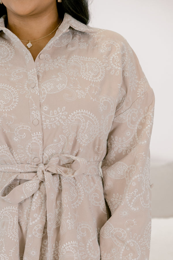 Chic Soul plus size clothing, long sleeve short beige dress with a belt, collar, buttons and white embroidery