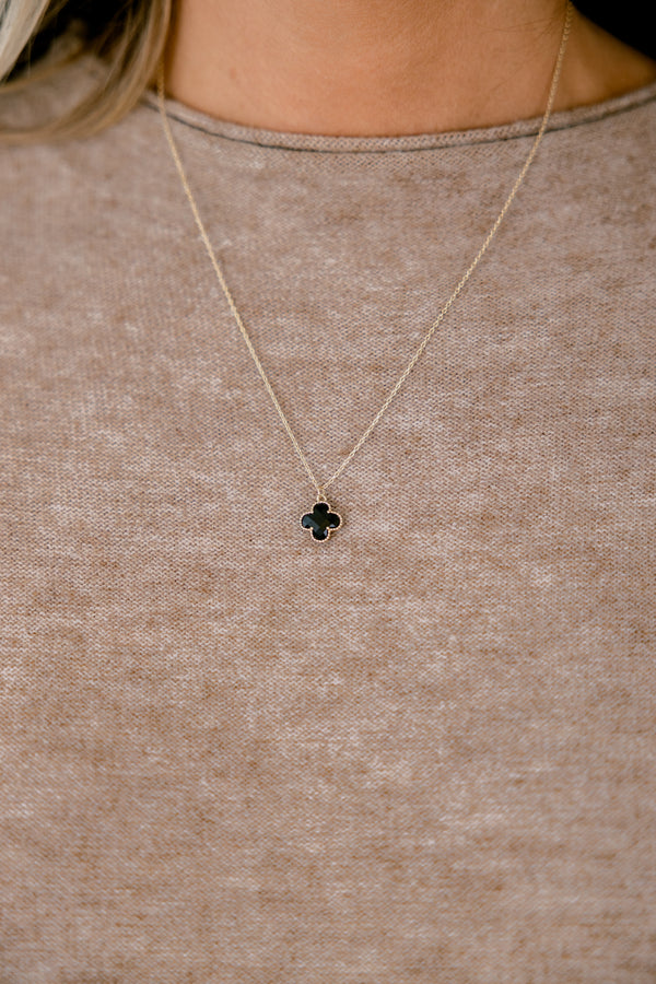 Chic Soul plus size clothing, gold necklace with a black small pendent hanging down on the center of the necklace 