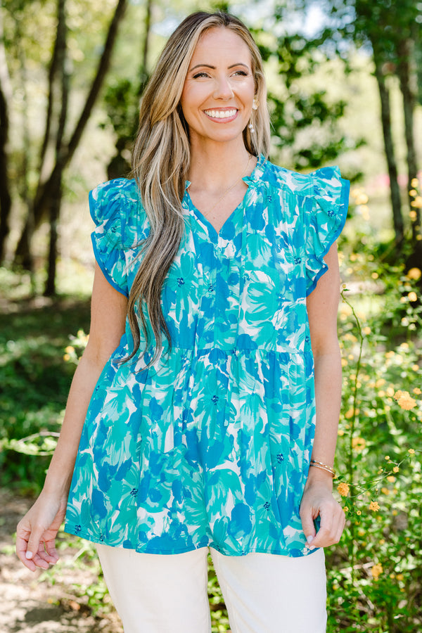 Chic Soul plus size clothing, blue casual babydoll top with a flutter sleeve and white and aqua floral pattern