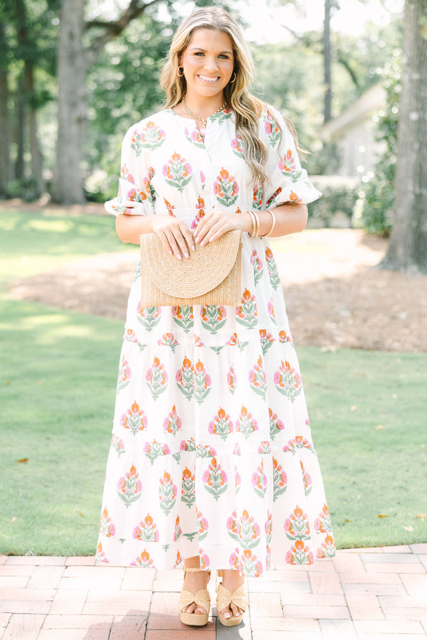 Plus Size white floral tiered maxi dress with short puff sleeves and a v-neckline.