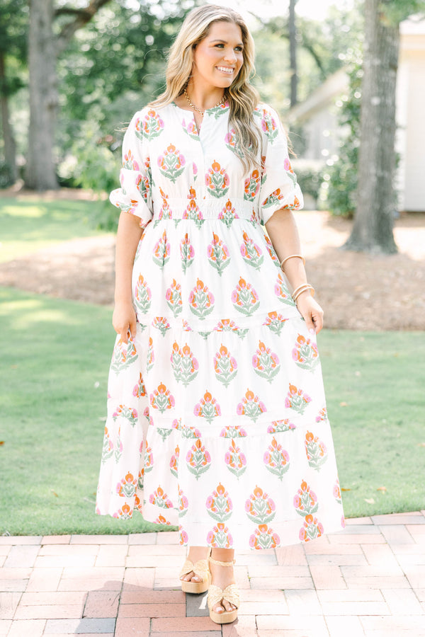 Plus Size white floral tiered maxi dress with short puff sleeves and a v-neckline.