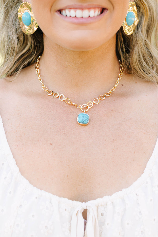 Plus Size gold chain necklace with a square turquoise stone pendant and toggle closure.