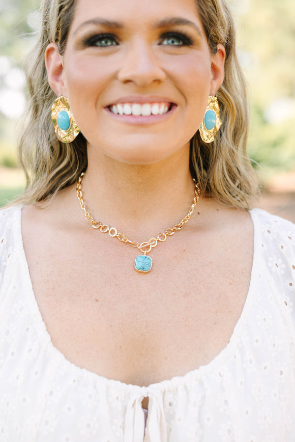 Plus Size gold chain necklace with a square turquoise stone pendant and toggle closure.