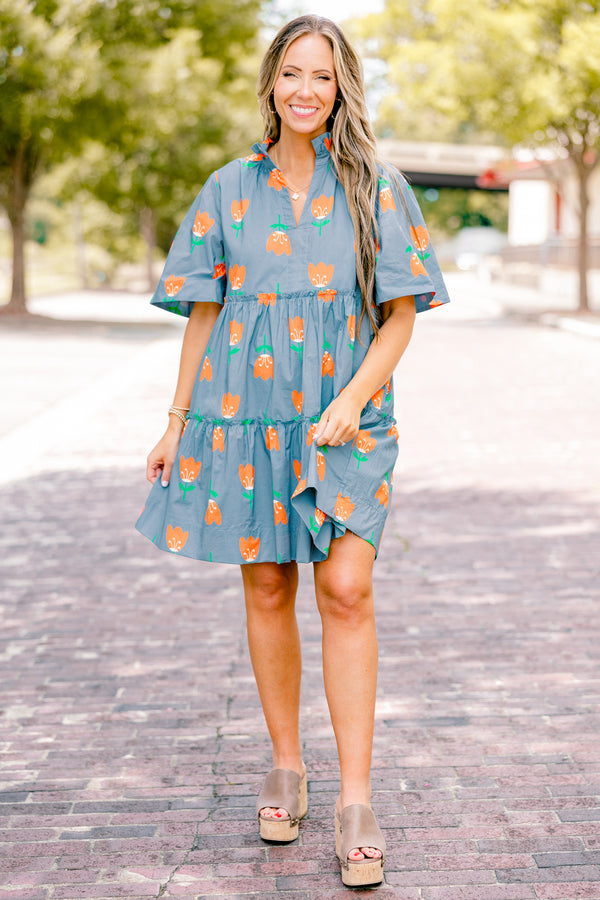 Chic Soul plus size clothing, orange baby doll dress with short sleeves and orange tulips throughout the dress