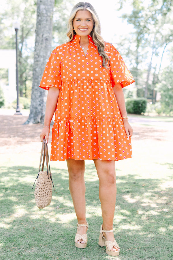 Plus size red floral mini dress with a flowy tiered silhouette and short ruffle sleeves.