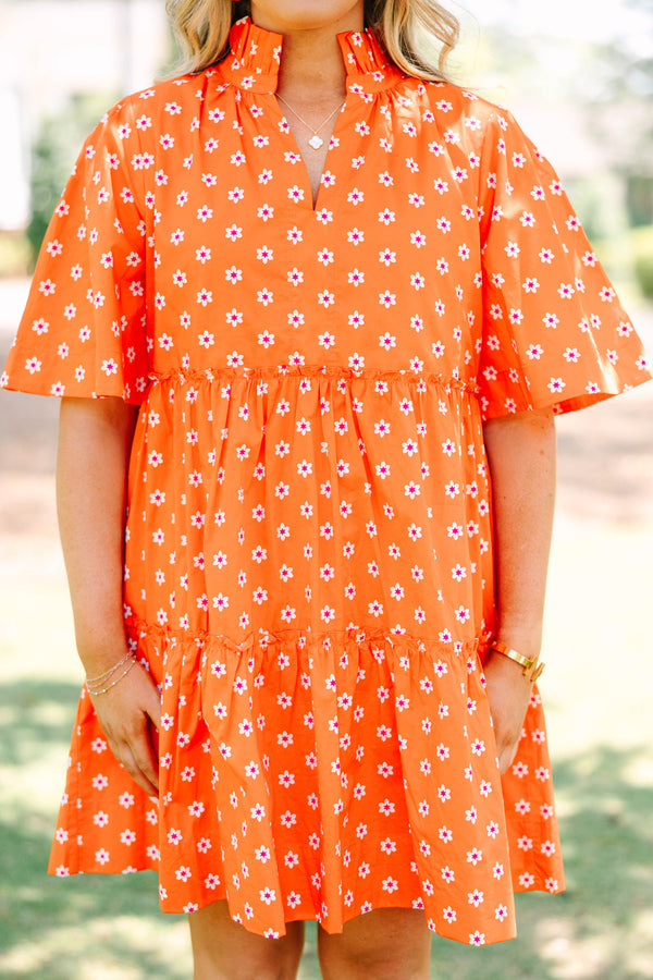 Plus size red floral mini dress with a flowy tiered silhouette and short ruffle sleeves.