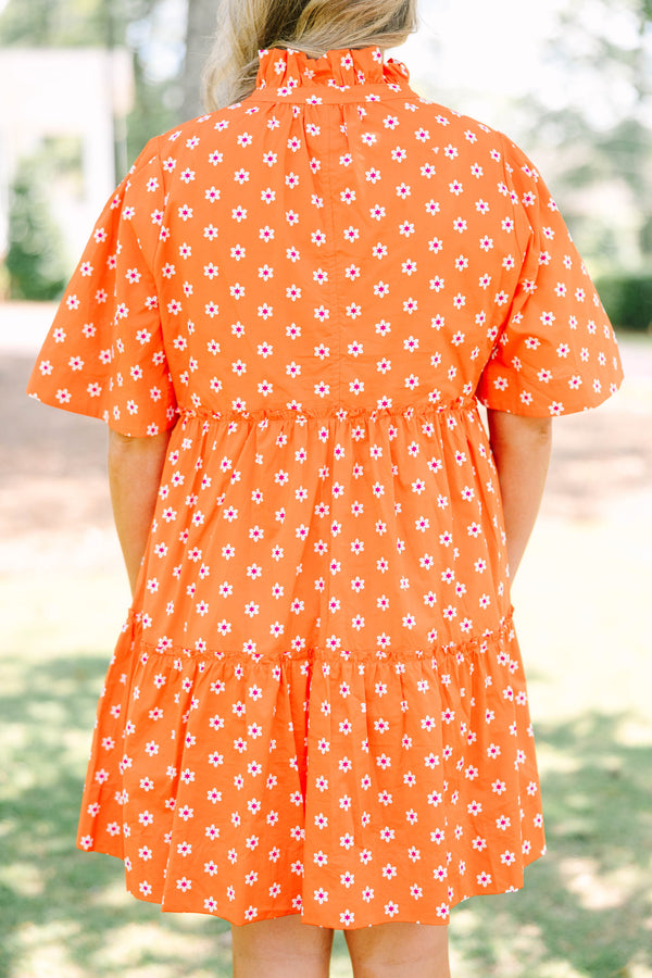 Plus size red floral mini dress with a flowy tiered silhouette and short ruffle sleeves.
