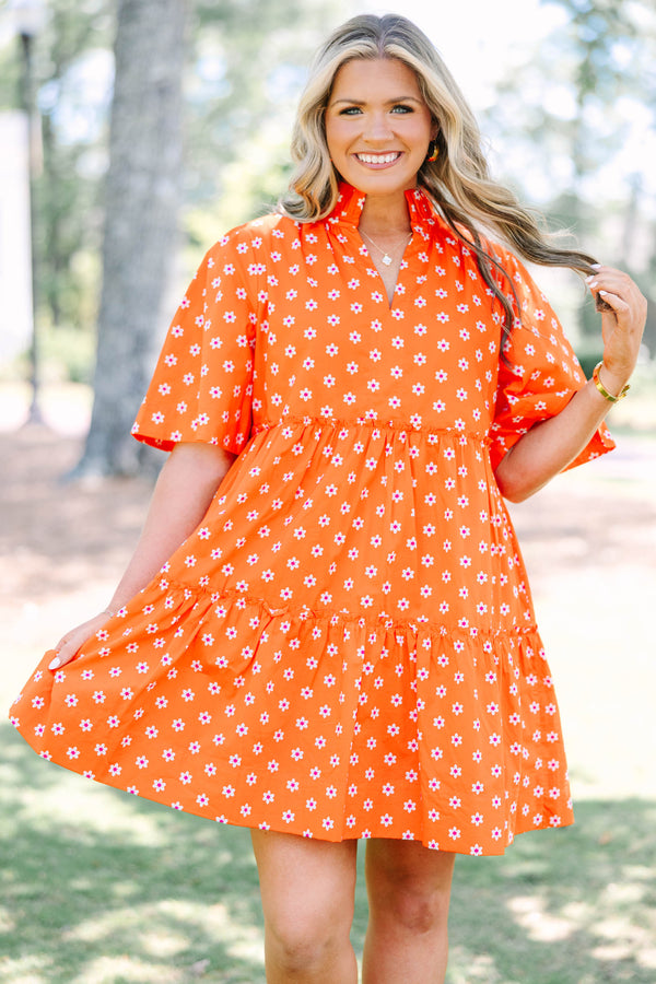 Plus size red floral mini dress with a flowy tiered silhouette and short ruffle sleeves.
