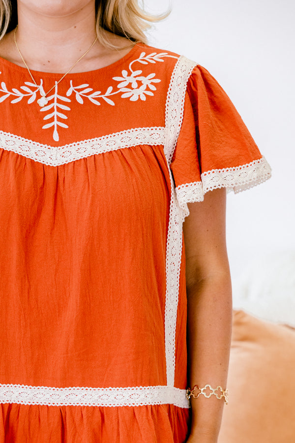 Chic Soul plus size clothing, short sleeve rust babydoll dress with lace details on each tier the neckline and at the end of the sleeves it also had a floral embroidery detail on the chest 