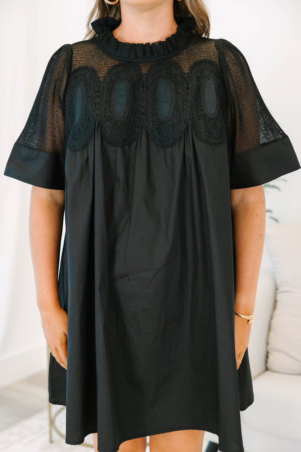 Plus size black cotton mini dress with a flowy fit, mesh yoke, and intricate lace detailing.