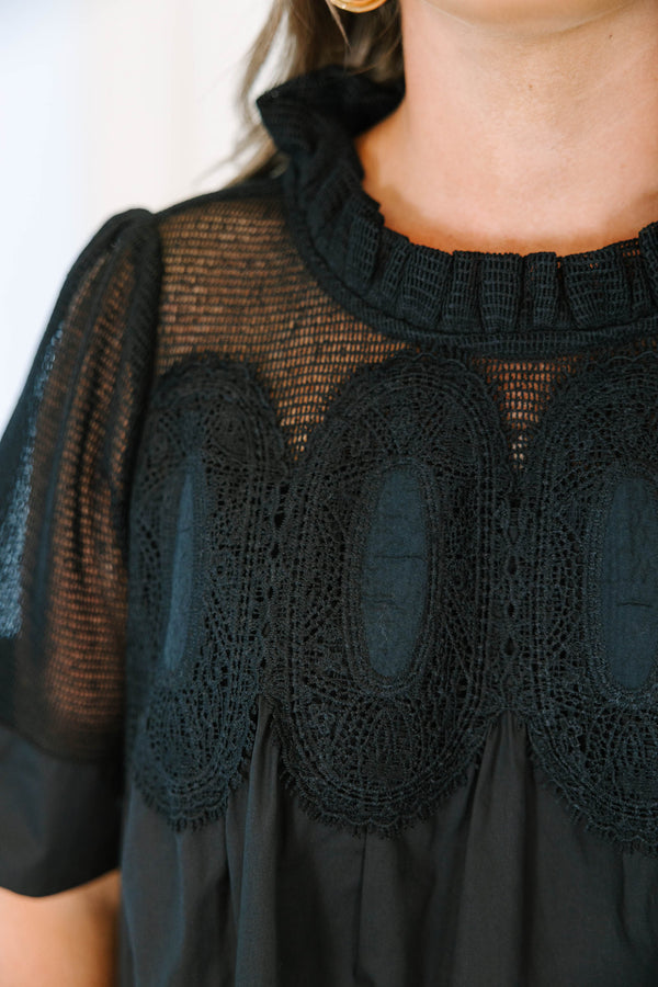 Plus size black cotton mini dress with a flowy fit, mesh yoke, and intricate lace detailing.