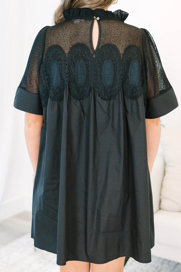 Plus size black cotton mini dress with a flowy fit, mesh yoke, and intricate lace detailing.