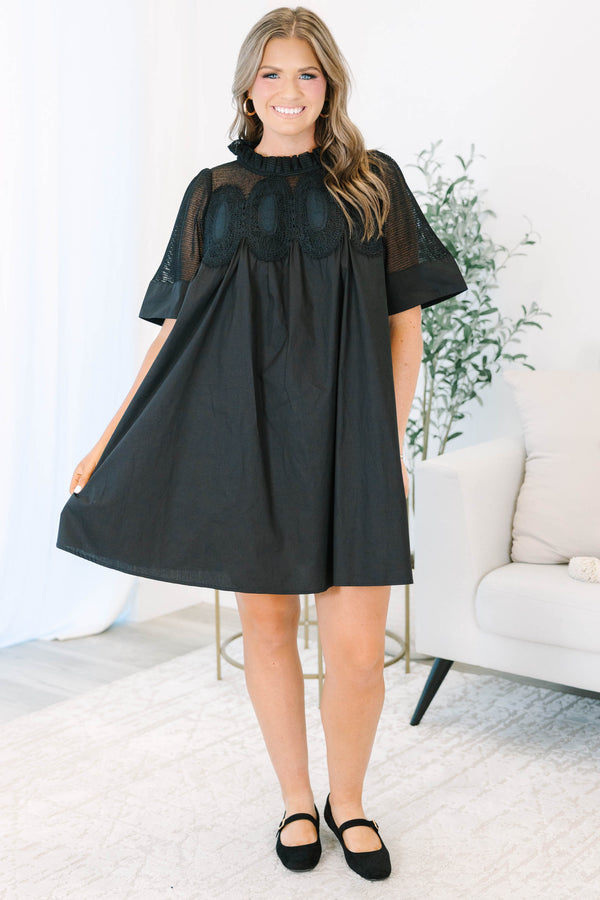 Plus size black cotton mini dress with a flowy fit, mesh yoke, and intricate lace detailing.