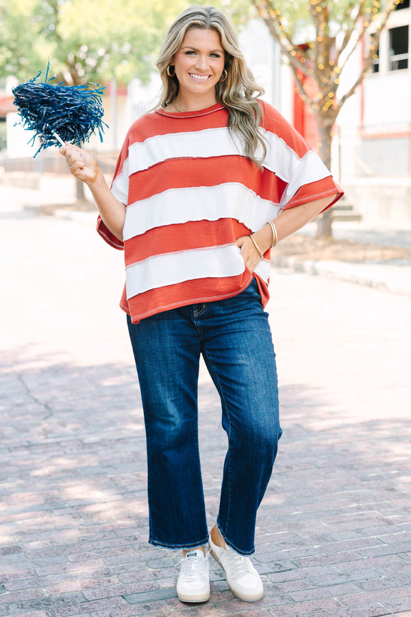 Plus Size rust and white striped French terry top with exposed seams and a relaxed fit.