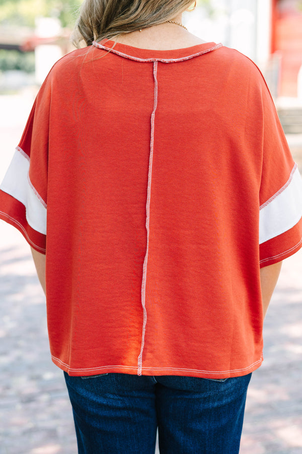 Plus Size rust and white striped French terry top with exposed seams and a relaxed fit.