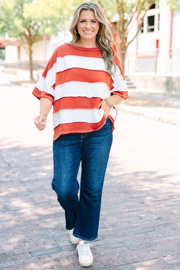 Plus Size rust and white striped French terry top with exposed seams and a relaxed fit.
