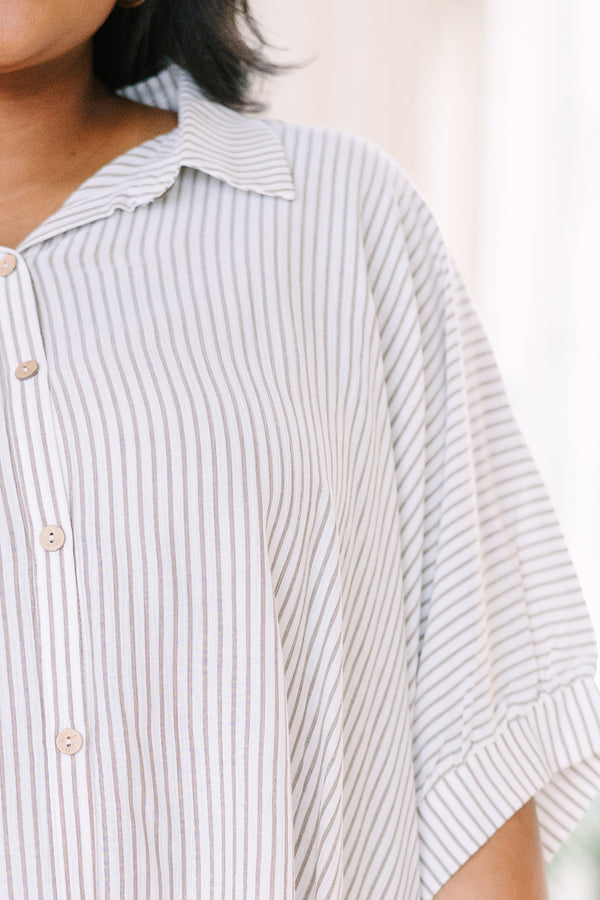 Relaxed taupe and white striped button-up top with dolman sleeves and a flowing silhouette.