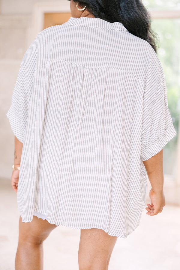 Relaxed taupe and white striped button-up top with dolman sleeves and a flowing silhouette.