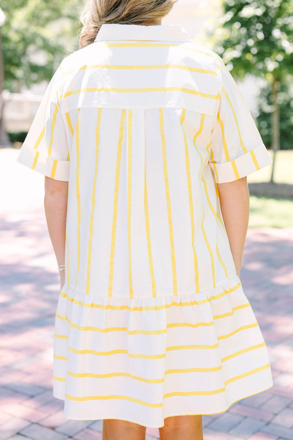 Plus Size yellow and white striped short sleeve shirt dress with a collared neckline and tiered hem.