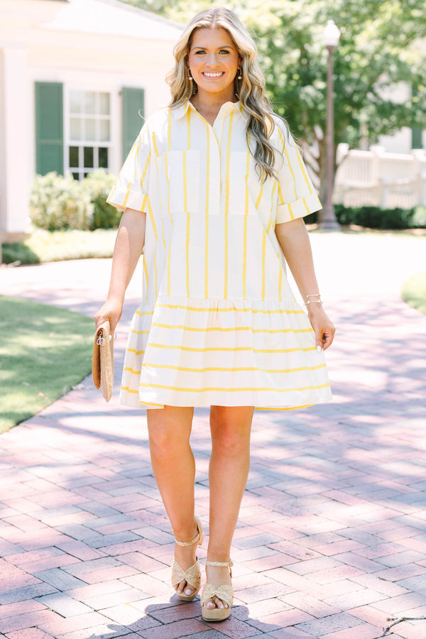 Plus Size yellow and white striped short sleeve shirt dress with a collared neckline and tiered hem.