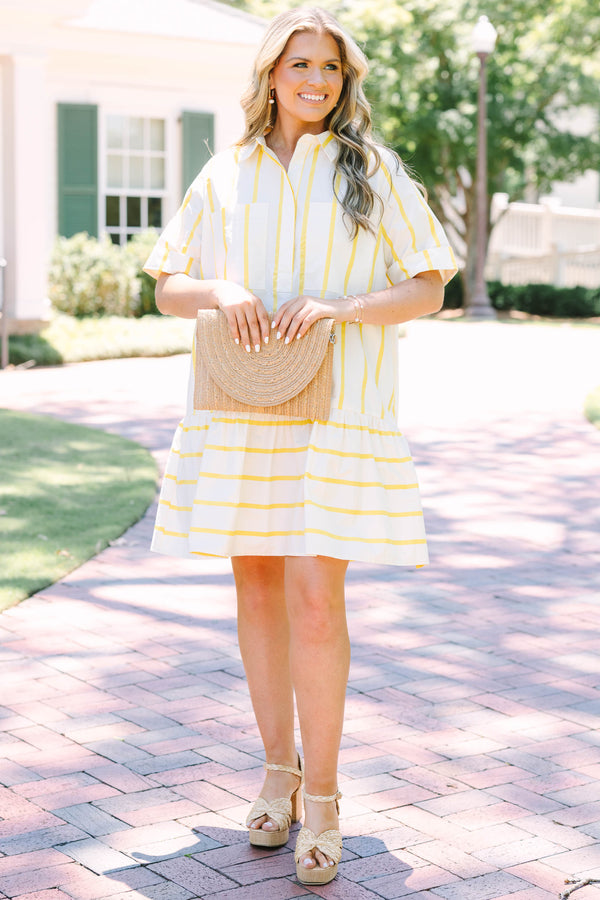 Plus Size yellow and white striped short sleeve shirt dress with a collared neckline and tiered hem.