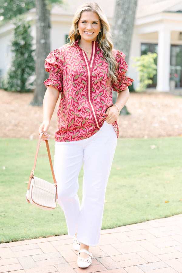 Plus Size wine-colored cotton top with a geometric pattern, V-neckline, and puffed short sleeves.